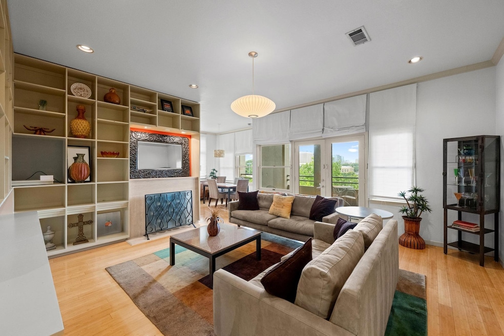 Living area with light wood-style floors and rece