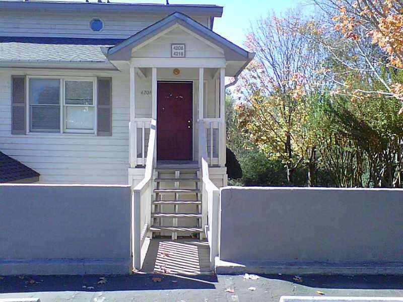 Exterior Front. View from parking area. The reside