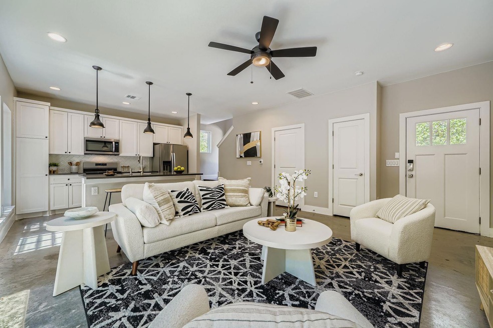 Living area featuring plenty of natural light, recessed lighting, and ceiling fan