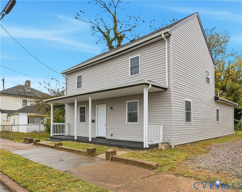 Traditional home featuring a porch