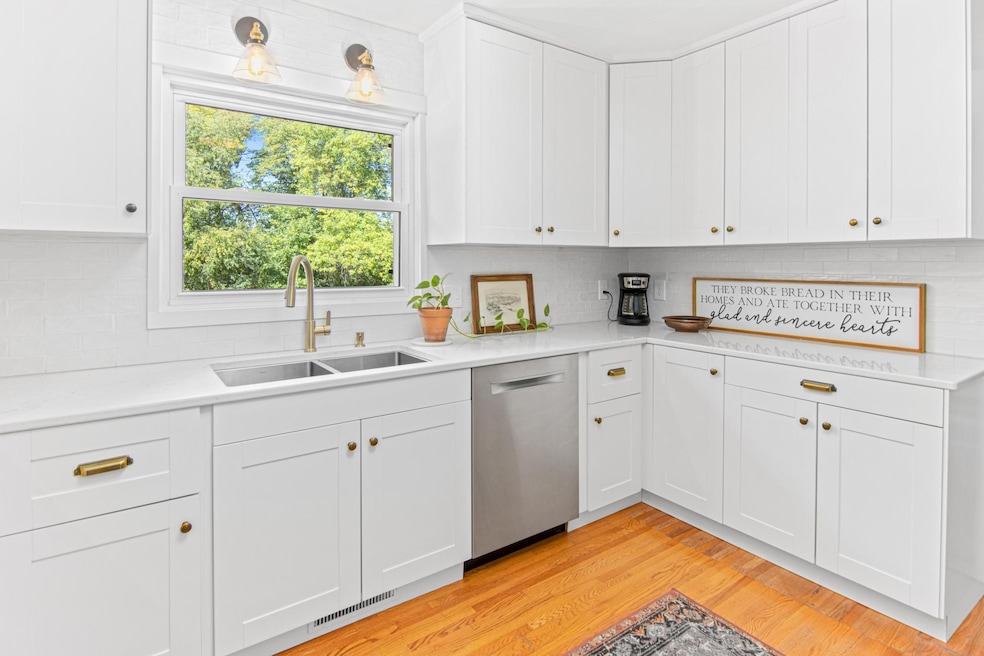 Quartz Countertops, designer hardware and lighting