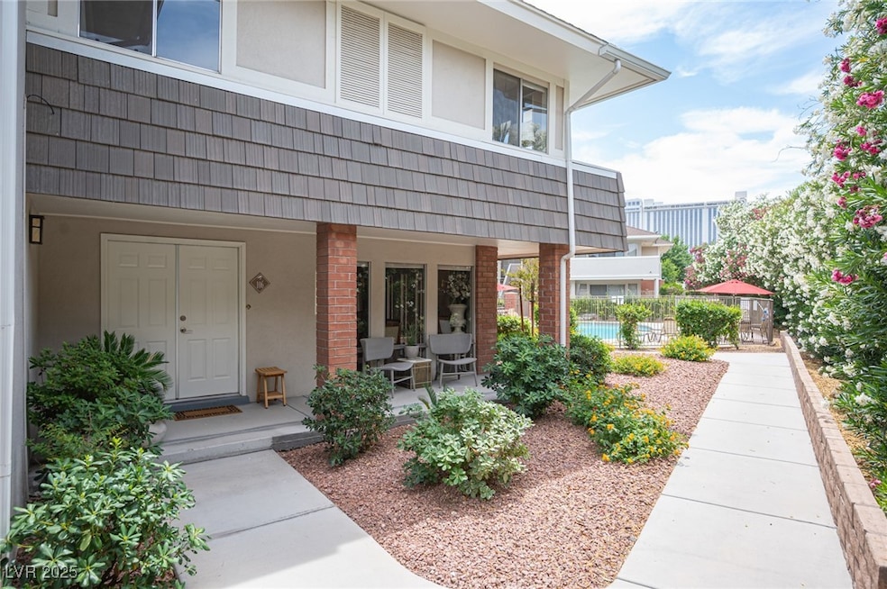 View of exterior entry featuring stucco siding, co