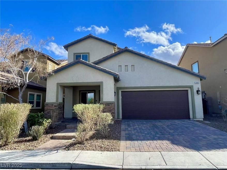 View of front of property with stucco siding, ston