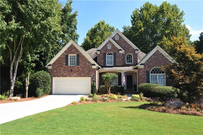 Beautiful 3-Sided Brick home situated on over 1/2 