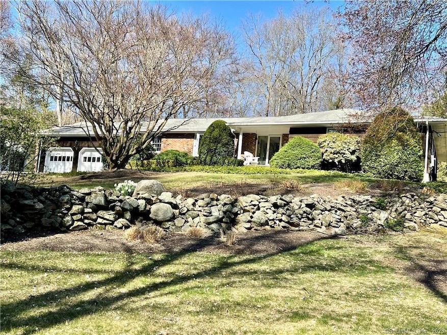 Welcoming groomed 2 acres with great curb appeal