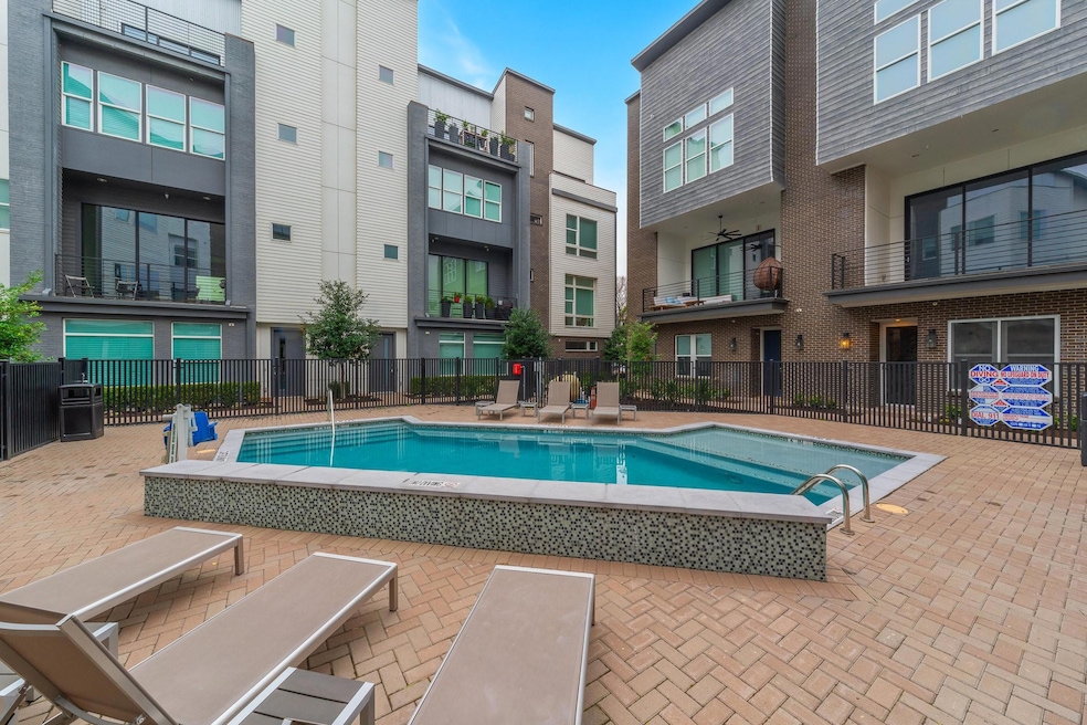 View of swimming pool featuring fence