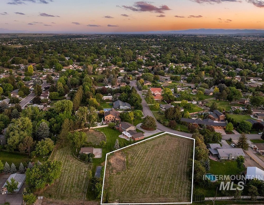 Aerial view of property and surrounding area featuring property boundaries highlighted