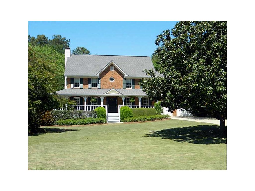 Exterior Front. Brick Front with wrap-around porch