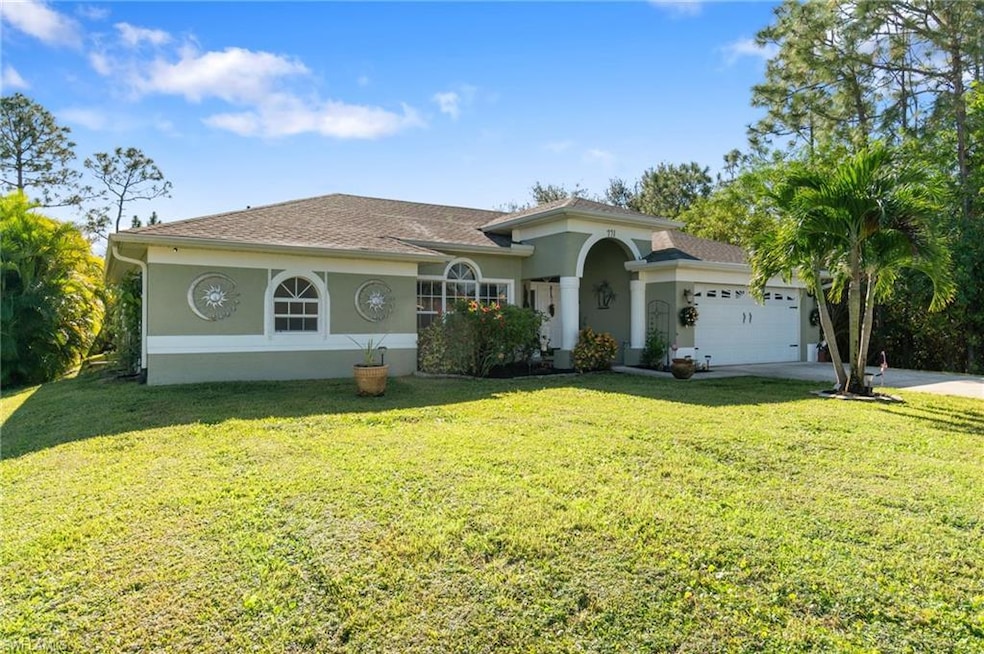 View of front of property featuring a front yard a