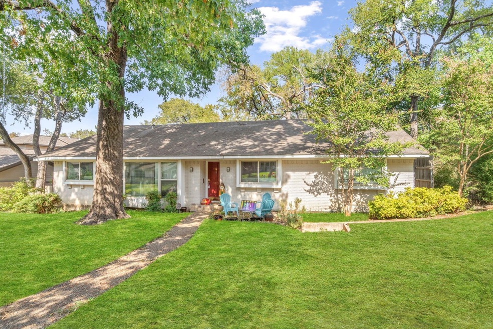 Ranch-style house with a shingled roof and a front