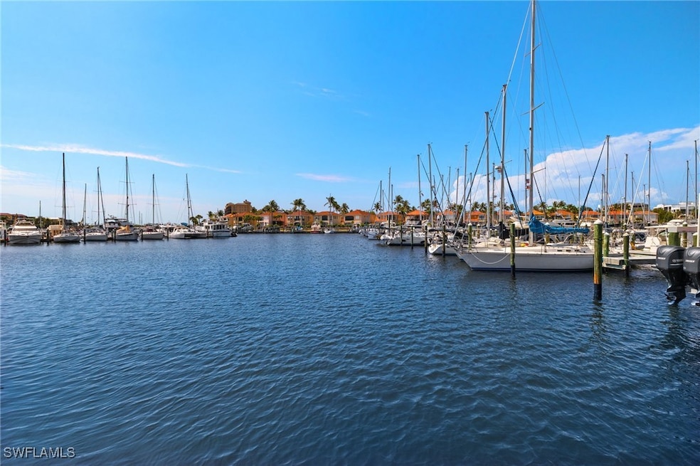 Water view featuring a dock