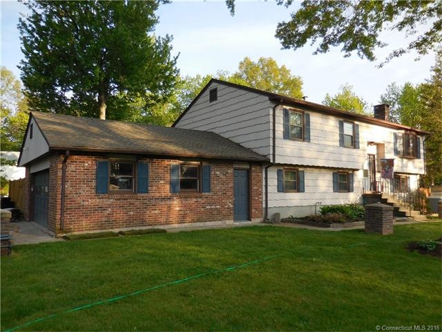 Exterior front.  The brick garage is oversized. Ac