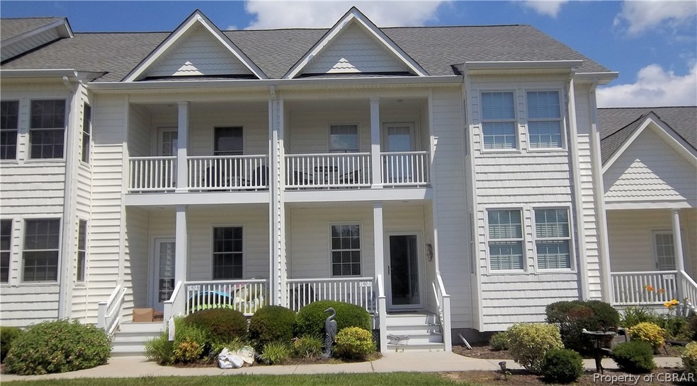 Multi unit property featuring a balcony and a porc