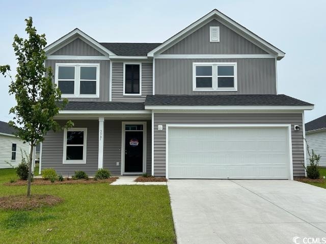 View of front of home featuring concrete driveway, a front lawn, an attached garage, a shingled roof, and a porch
