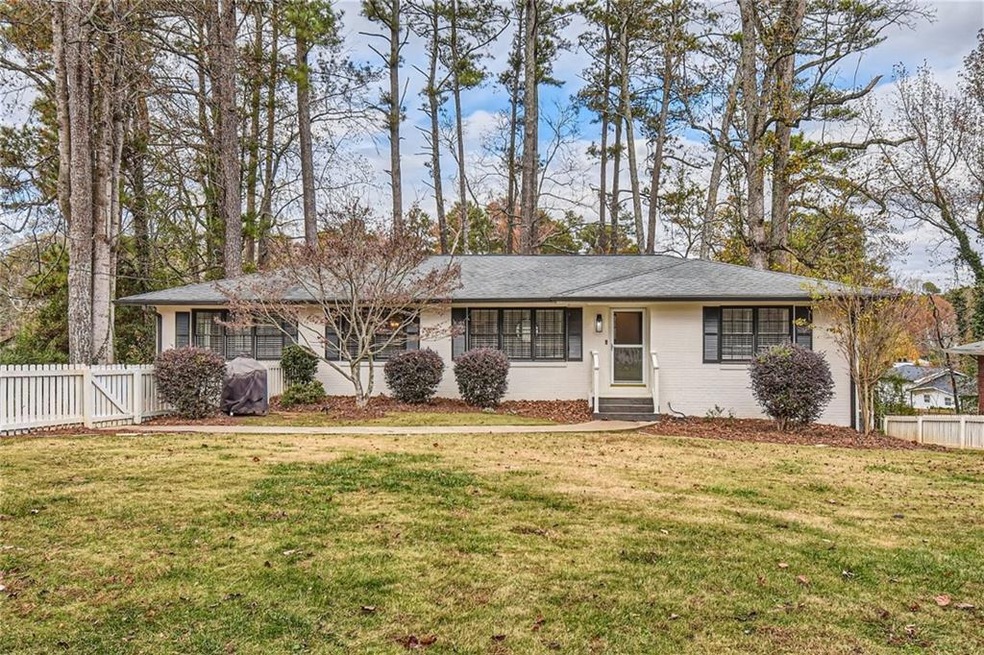 Single story home featuring a fenced front yard, p