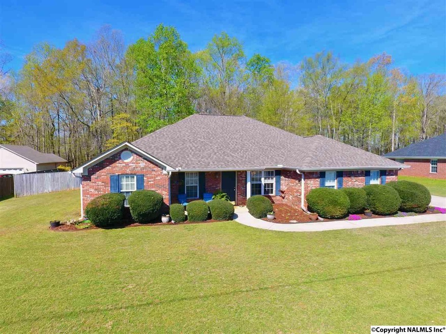 Enjoy the privacy of your own slice of heaven with 1.5 acres including hardwood trees, trails through the woods and a meandering stream.
