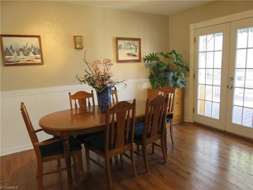 Refinished oak flooring - dining room with door leading to large deck and gazebo