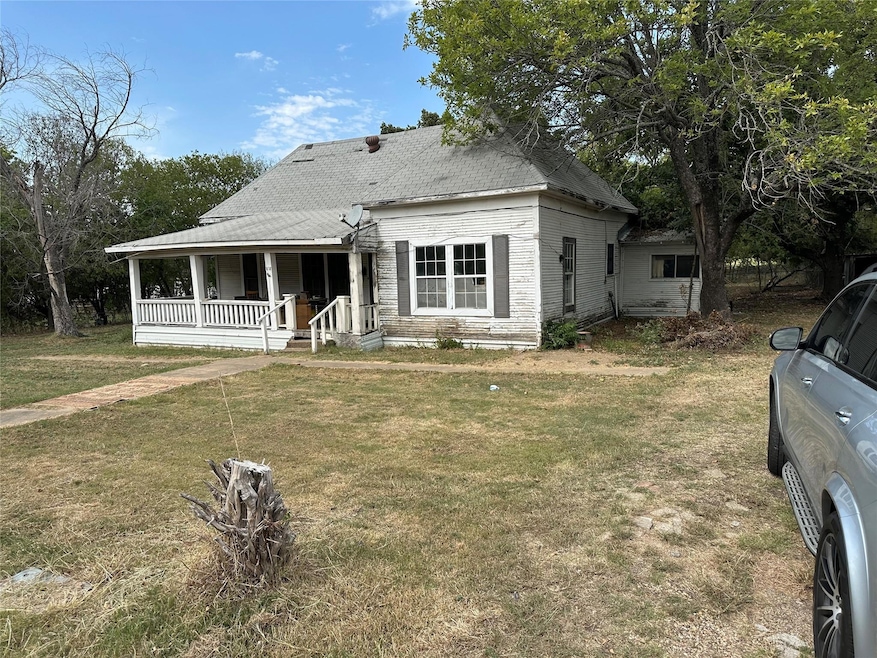 View of front of property with covered porch and a