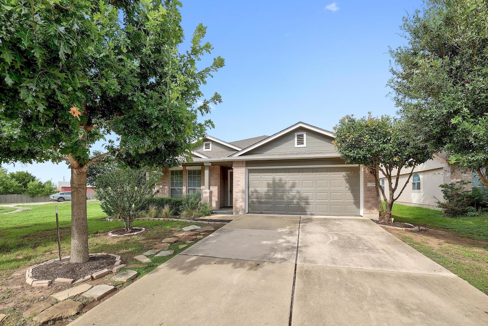Ranch-style home with a front lawn, concrete driv