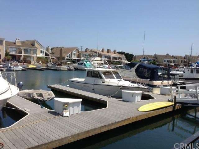 Boat slip right behind your patio will hold a 30+ 
