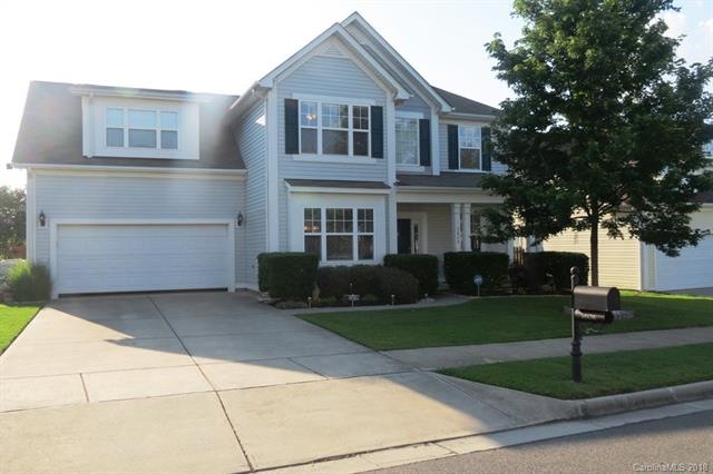 CURB APPEAL WITH MANICURED LAWN