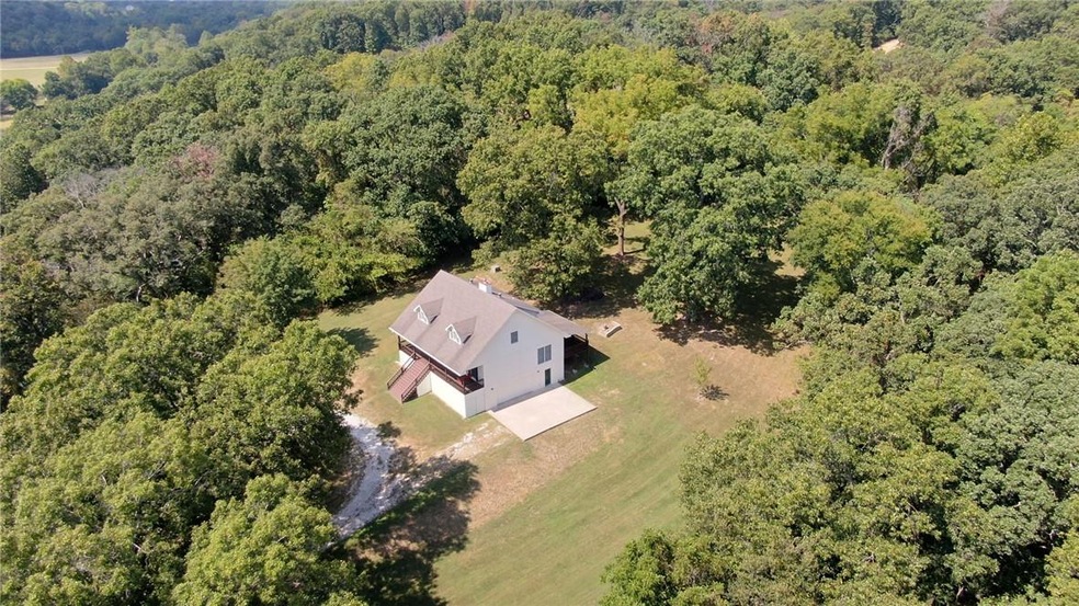 The home is located on a beautiful setting of almost 7 acres.