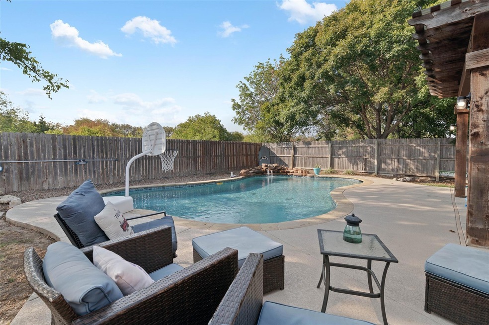 Amazing backyard oasis! Pool has waterfall feature. Plenty of room for outdoor entertaining.
