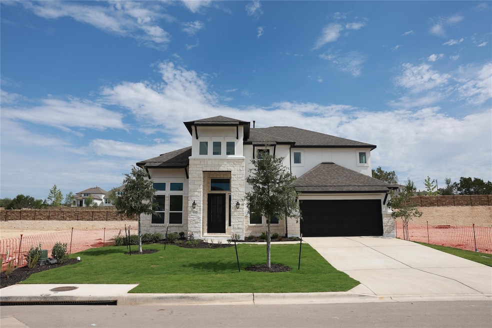 View of front of property with stone siding, an a