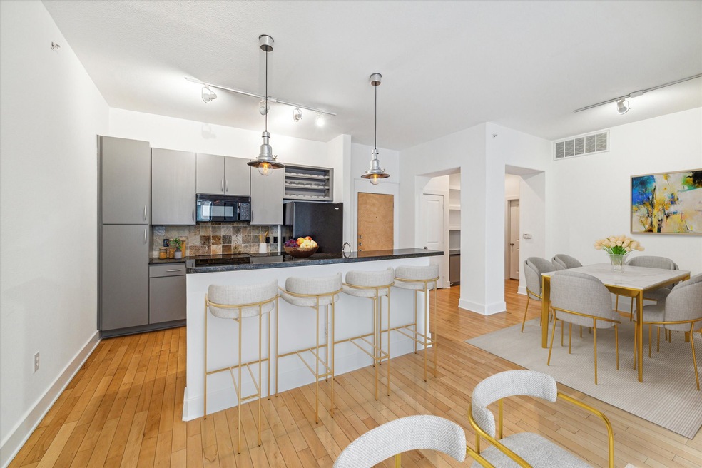 The spacious island kitchen seamlessly connects to