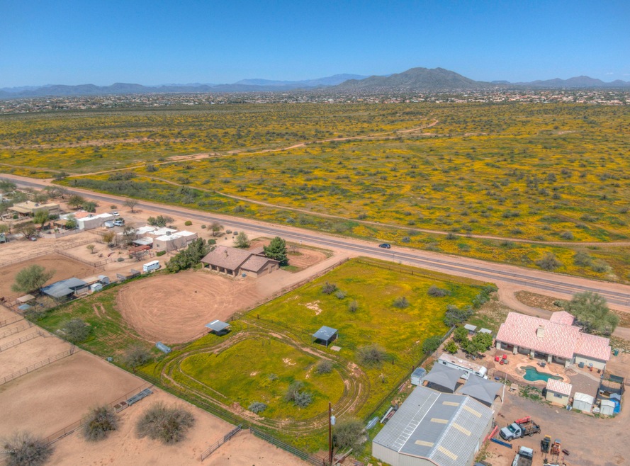 Home & two acres across from state land!