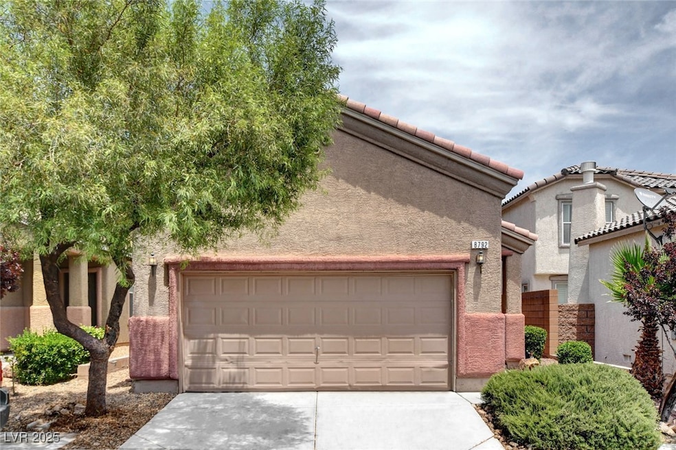 View of front of property with concrete driveway,