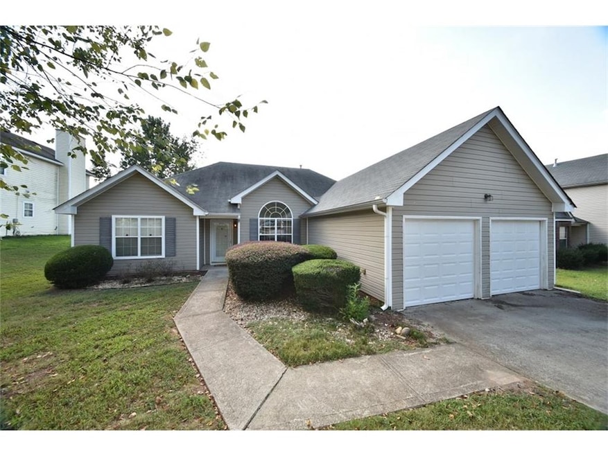 Welcome Home! 2 car garage & paved walkway