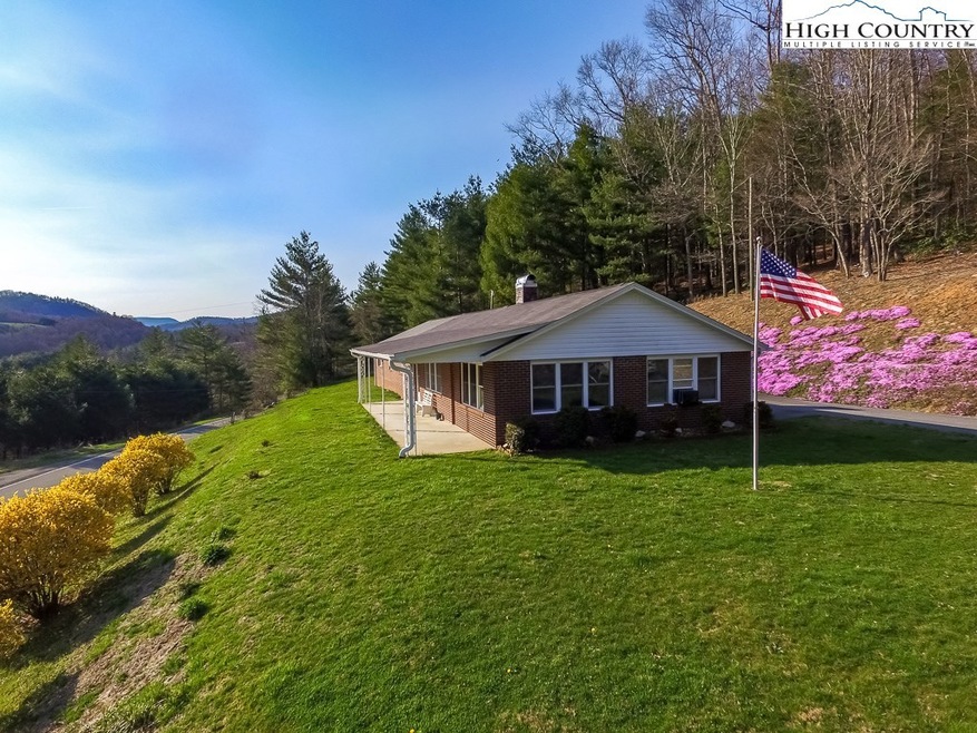 Located in the Ashe County, this home provides all