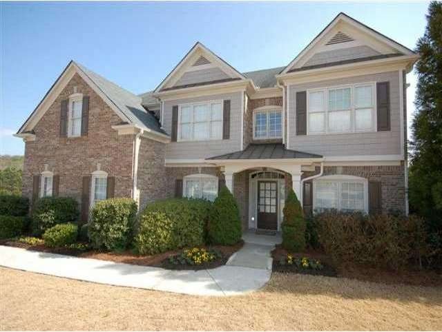 Exterior Front. Pristine 3-sides brick on level co