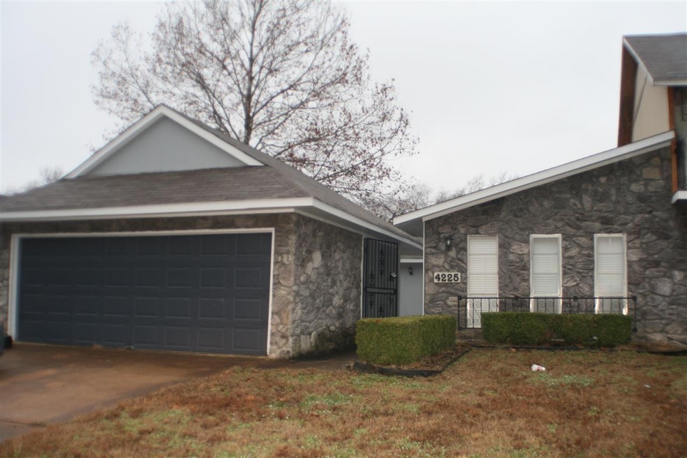 Has beautiful gray stone exterior. 2 Car garage an