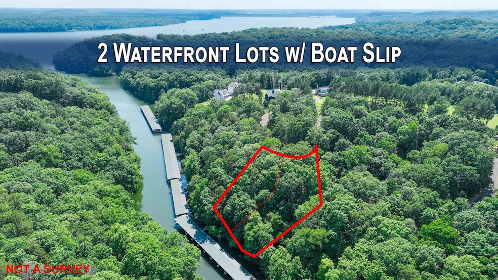 Aerial view of property's location featuring property parcel outlined and a nearby body of water