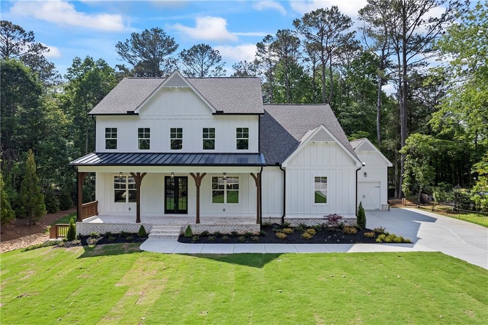 Modern farmhouse style home featuring board and ba