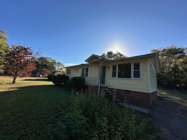 View of front of property with a front lawn