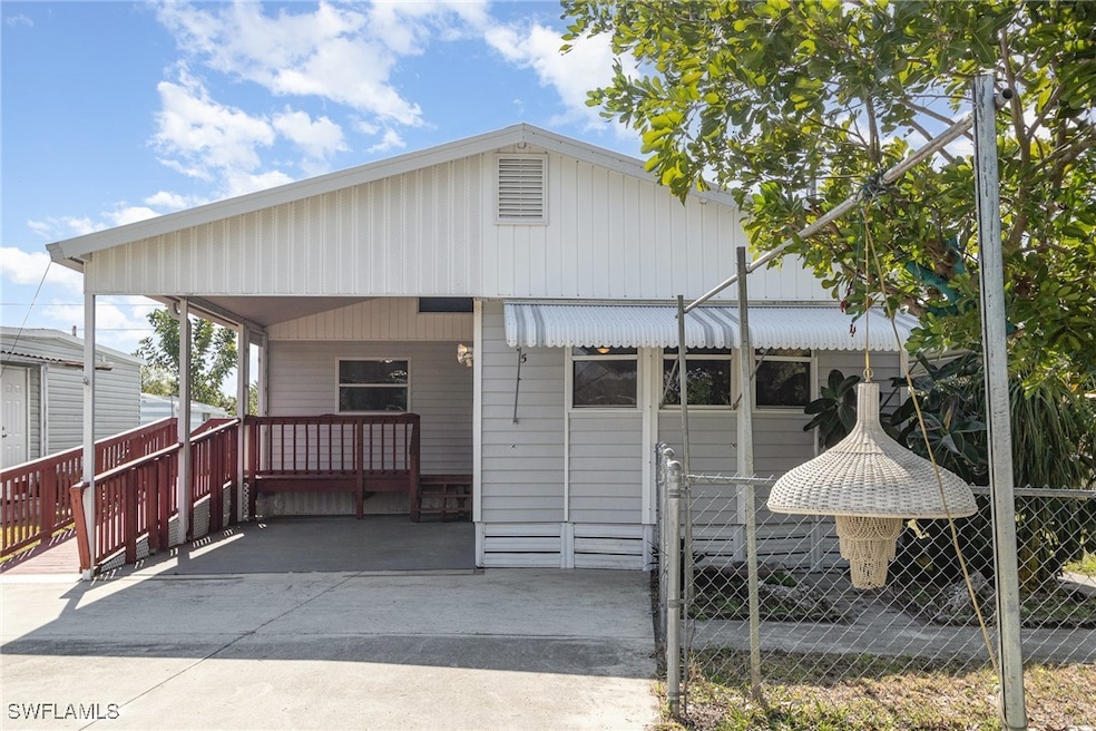 View of front of house with a carport
