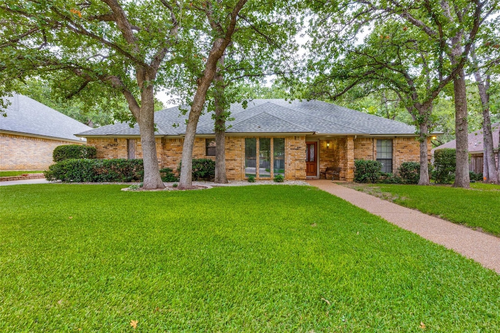 Ranch-style house featuring a front lawn