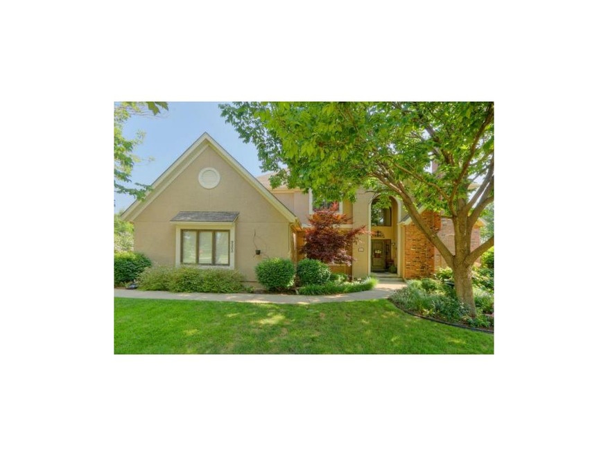 Mature trees and great curb appeal, with stucco an