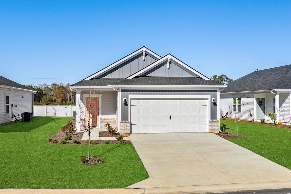 Craftsman house with cooling unit, a front yard, a