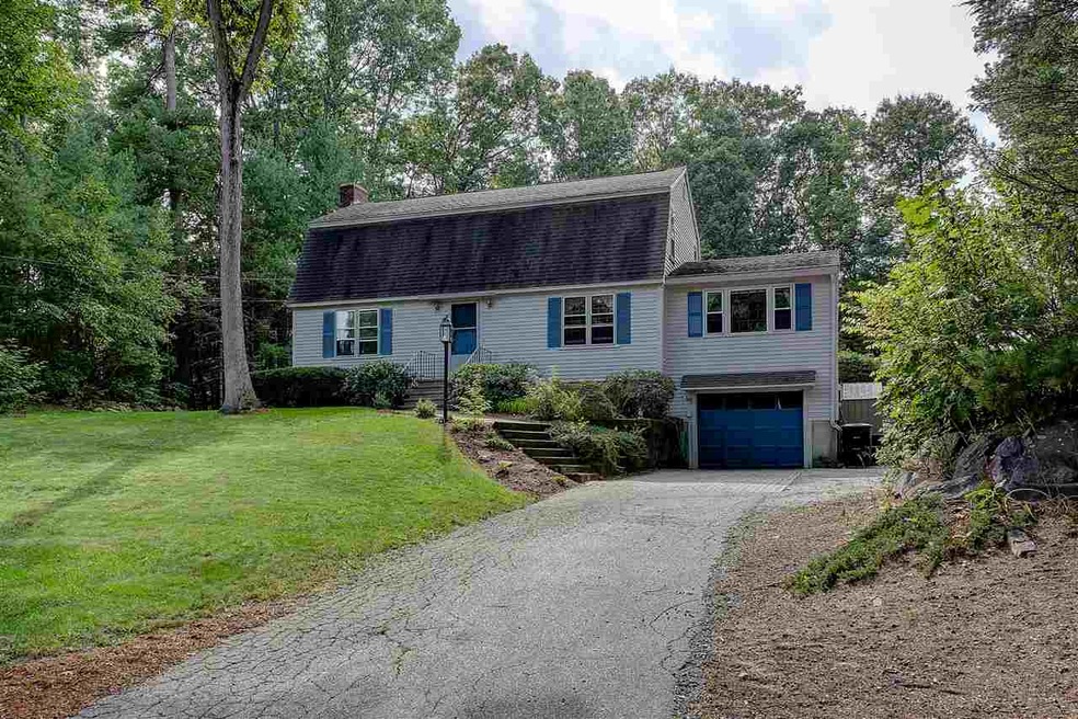 Located in wooded development with private green s