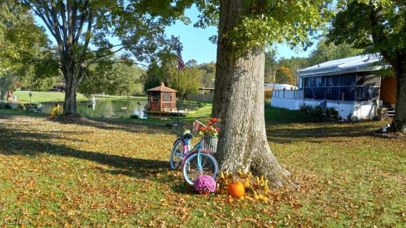 View of yard with a sunroom