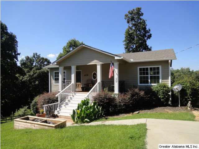 Front of home with concrete drive.