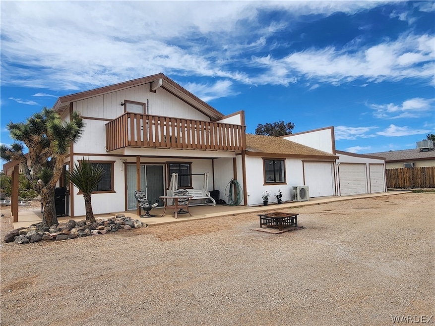 Front of the home with a garage with 3 parking spa