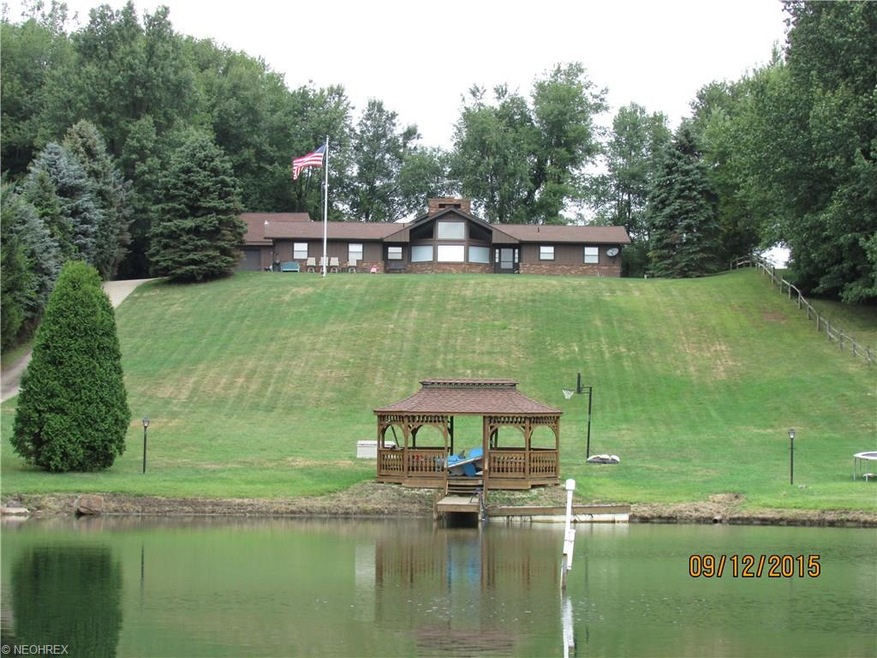 Stocked pond, detached and attached garage. 4 bedr