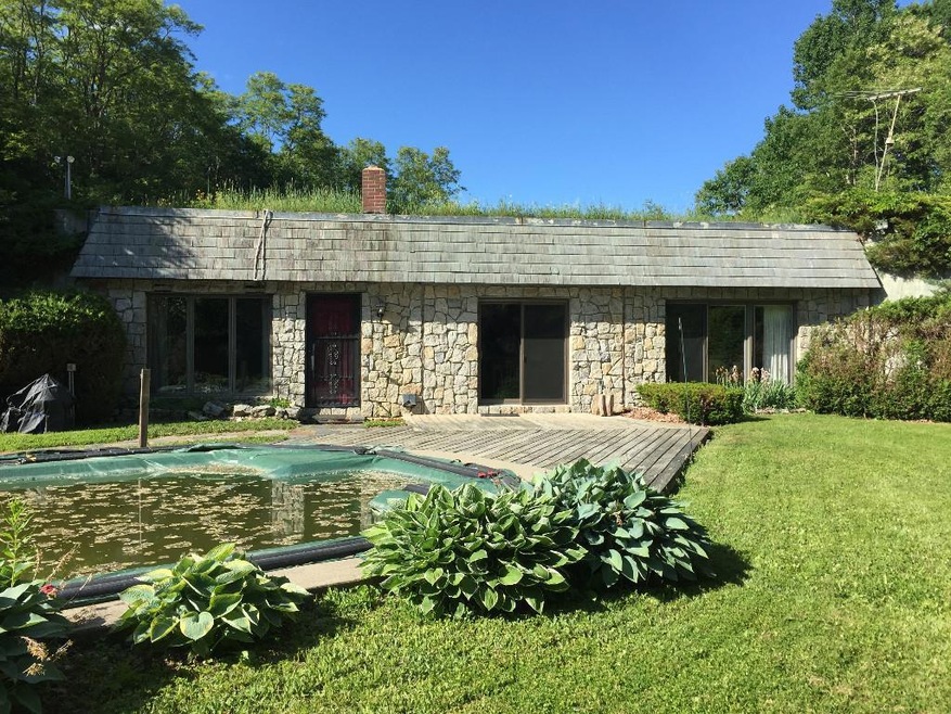 This unique bermed home is privately...