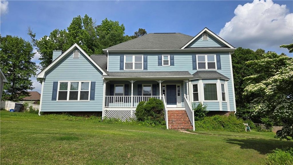 View of front of property featuring a porch, a fro