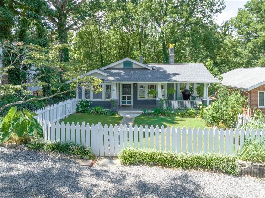 Charming 1920s craftsman bungalow with modern updates convenient to vibrant shopping and dining scene throughout West Asheville.